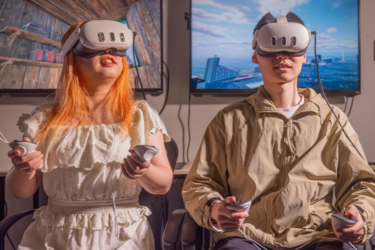 Computer Science students using VR headsets.