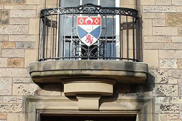 The crested window on the Principal's Office building