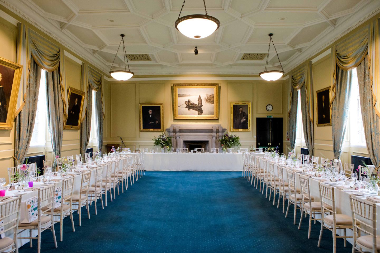 Long tables set for wedding breakfast in Lower College Hall