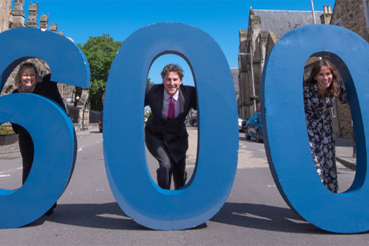 Holding 600 foam letters in the street