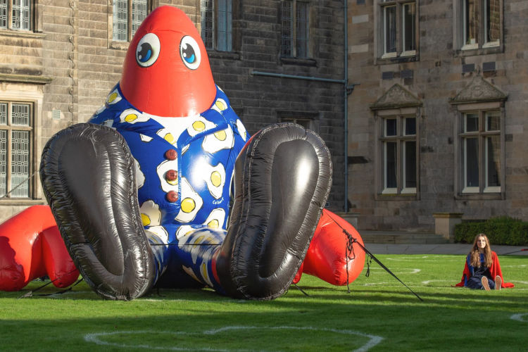 Philip, the giant lobster, with a student on St Salvator's Quadrangle at the University of St Andrews