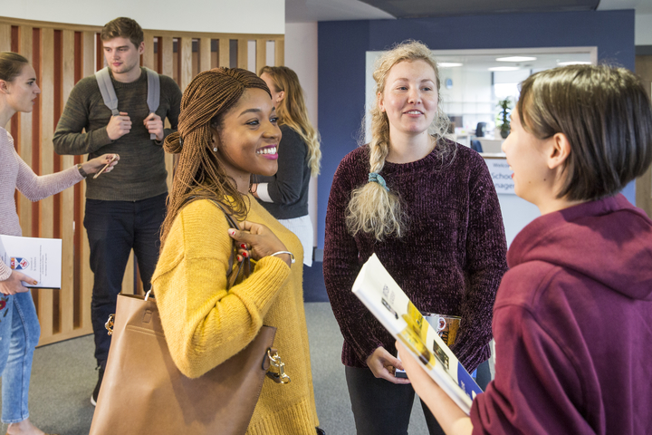 Three women postgraduate students talking