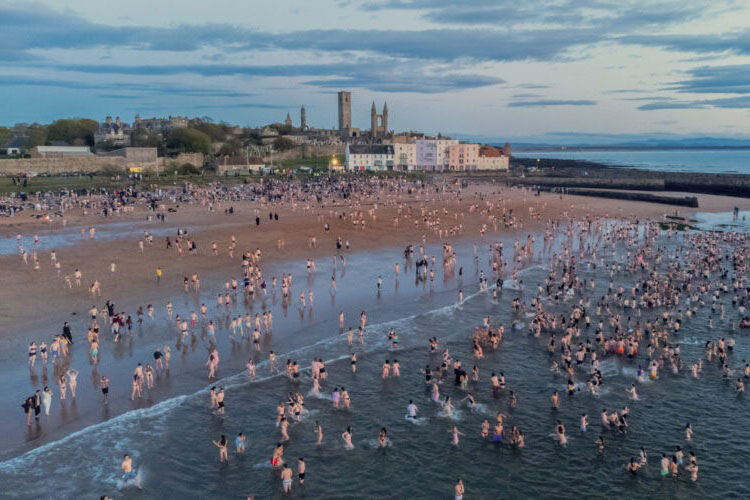 Hundreds of students run into the sea at St Andrews beach