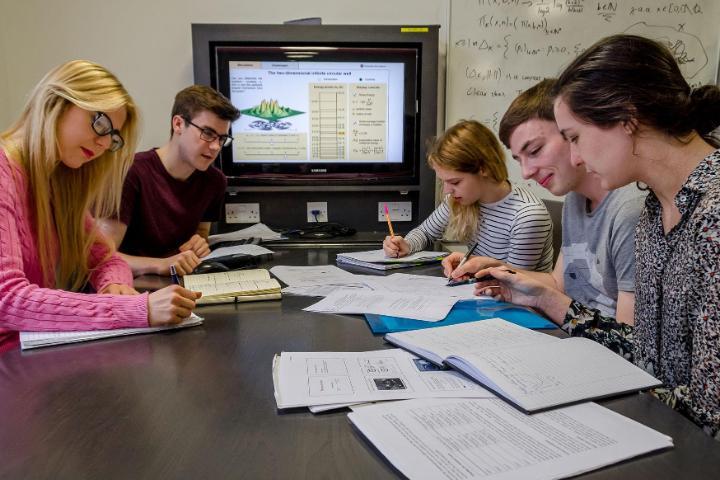 Group of students in a media room in the School of Physics and Astronomy