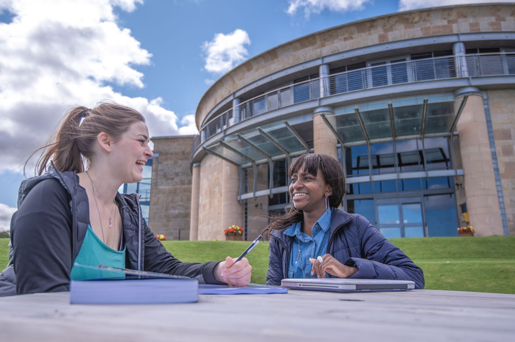Students sat outside of the Gateway Building