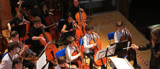 Children playing in an orchestra