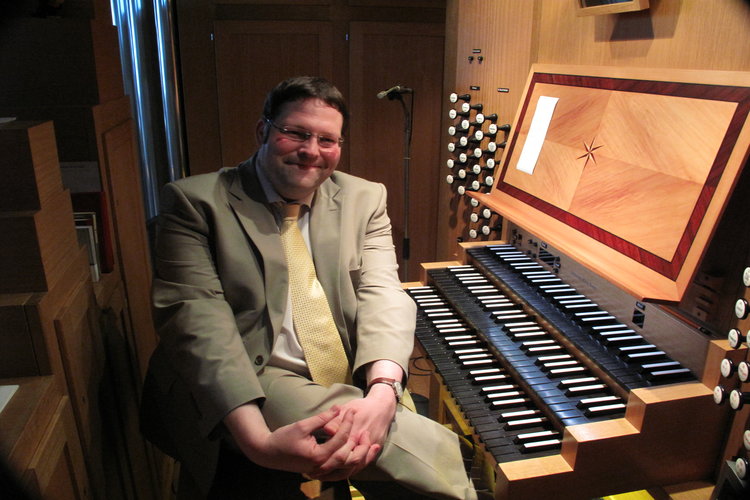 A Professor sitting at an organ