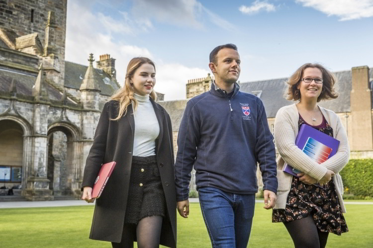 PhD students walking in the Quad