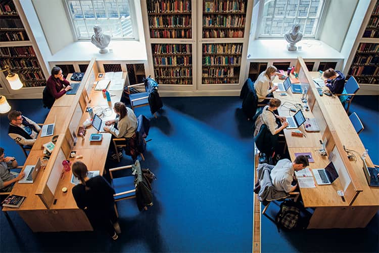 Students researching in the library