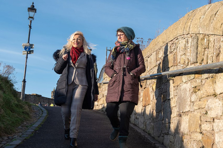 Paloma Gay y Blasco and Liria de la Cruz walking in St Andrews