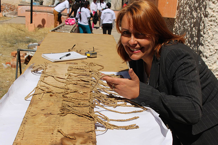 Sabine Hyland studying khipus