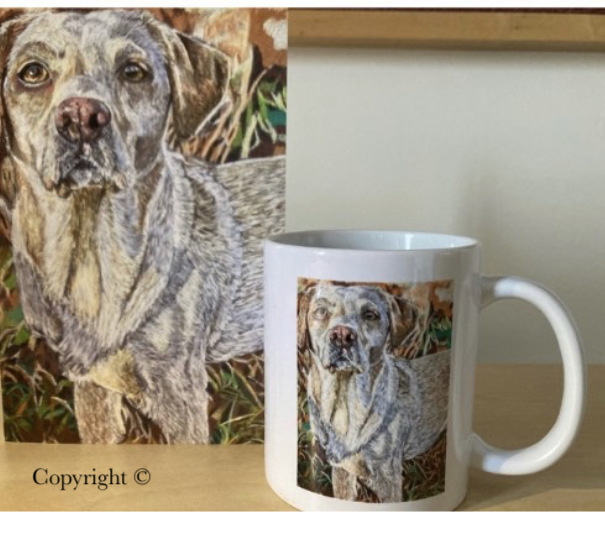 Picture of artwork of a dog, with the same artwork on a mug.