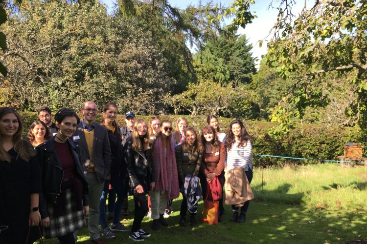 MLitt bee walk - students with the hive in the background