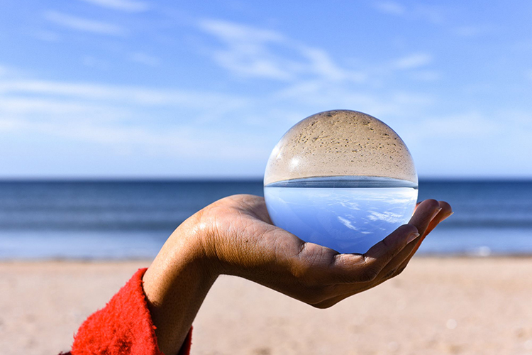 seascape shown through a prism held in a person's hand