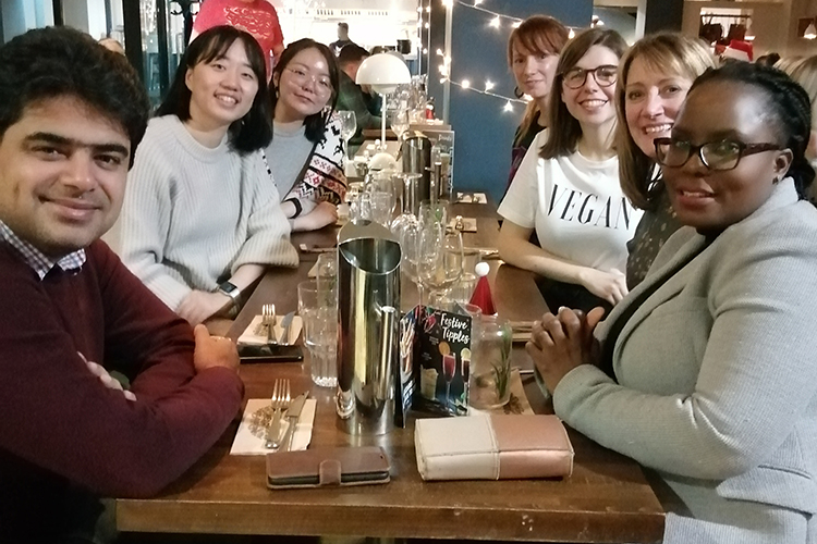 members of the School of Management research postgrad cohort enjoy a festive meal