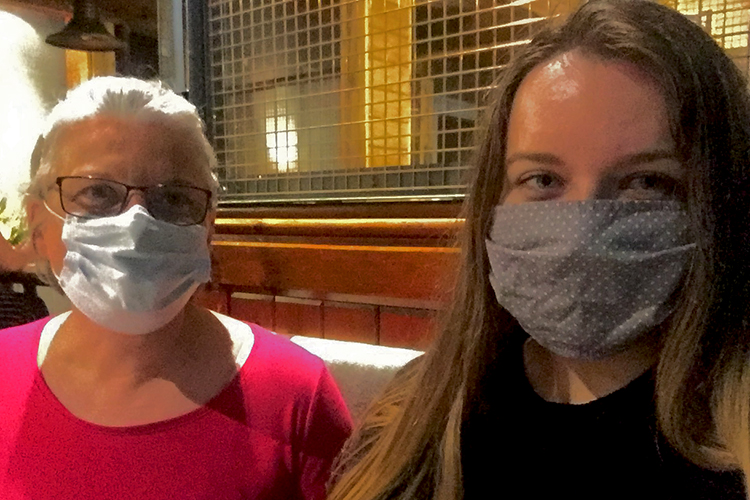Laurence Lasselle and Samantha MacRae meeting Hillhead Bookclub in Glasgow, wearing face coverings