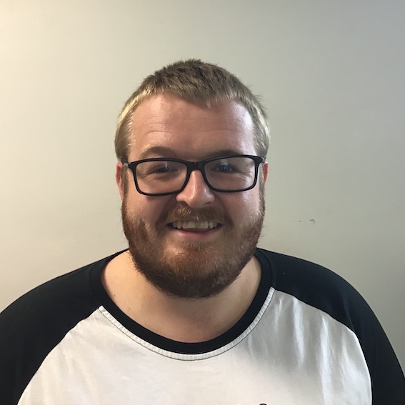A headshot of Dr Tom Coleman