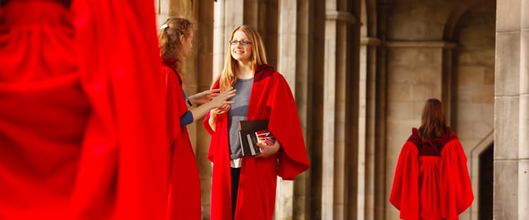 Students wearing their red gowns