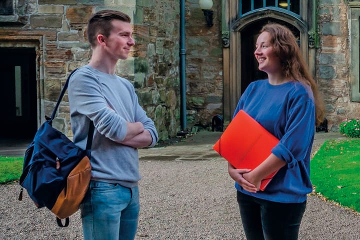 Two students talking in St Marys Quad