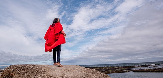 student standing on rocks