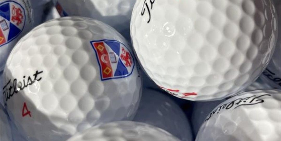 Close up image of University of St Andrews branded golf balls Close up image of University of St Andrews branded golf balls