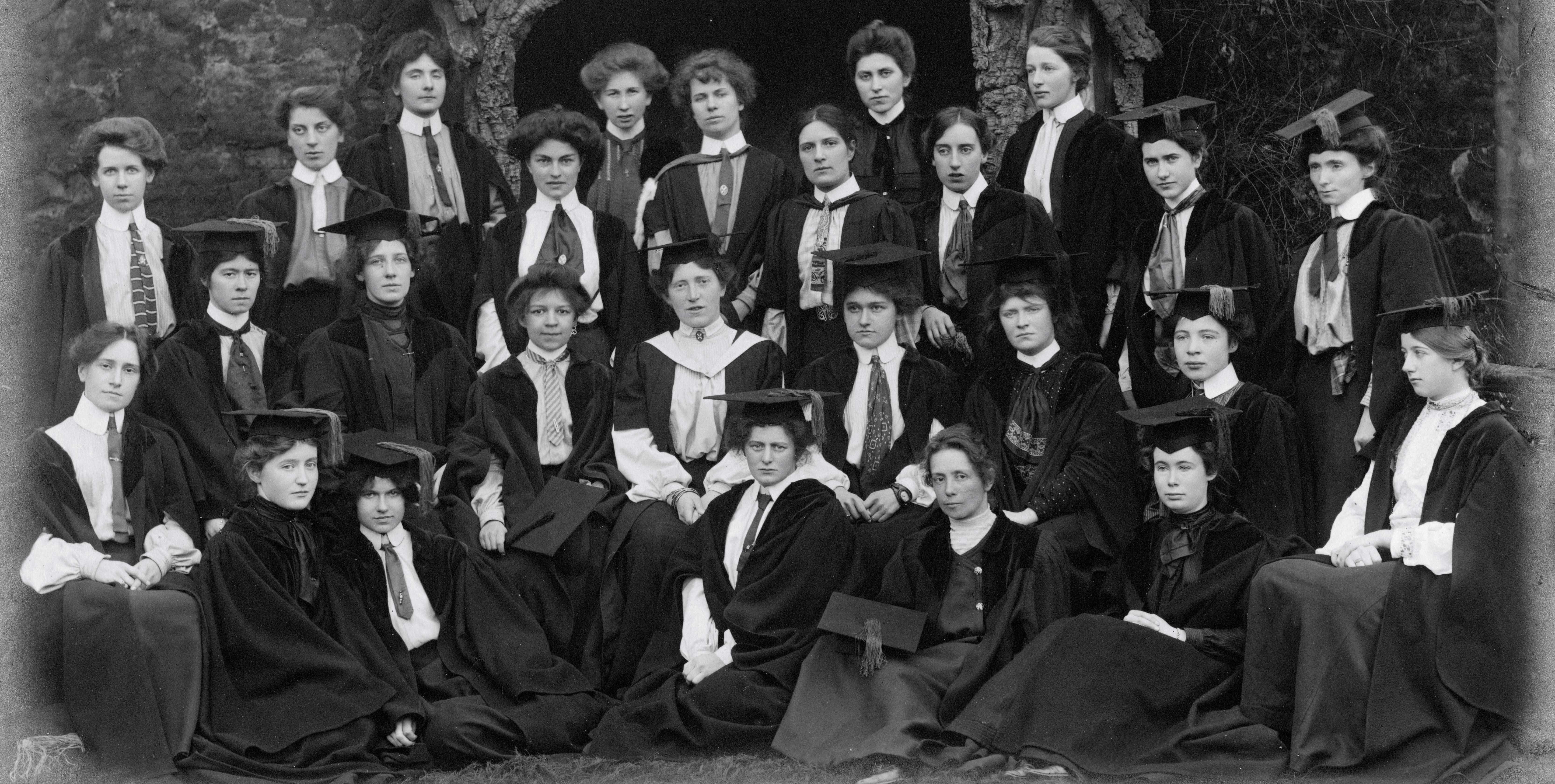 A black and white image of a group of University Hall students in formal academic dress A black and white image of a group of University Hall students in formal academic dress
