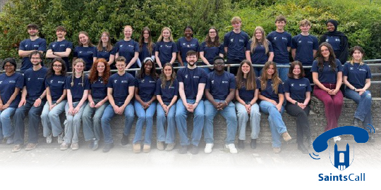 A large group of student SaintCallers pose for a team photo
A large group of student SaintCallers pose for a team photo