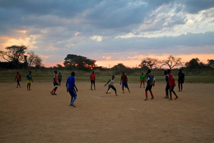 Students playing football at Sunset.