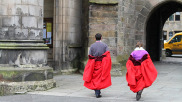 Students in gowns from the rear