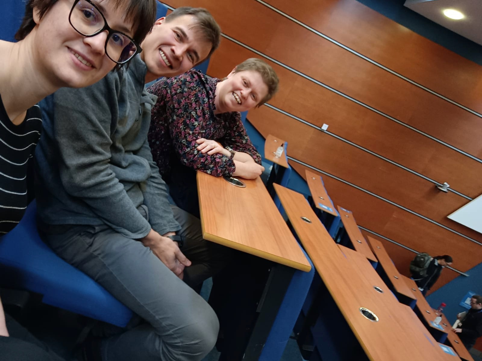 Alexey Bogdanov, Elena Mocanu and Janet Lovett in a lecture theatre.